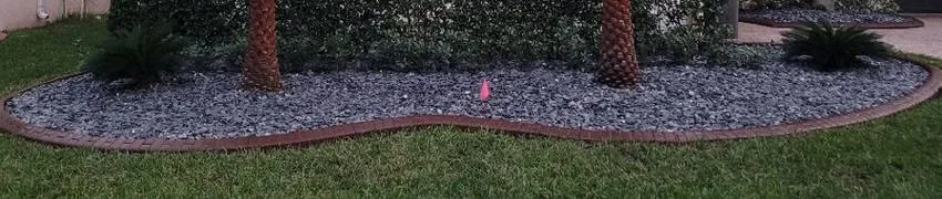Custom-designed garden concrete edging installation in Palm Beach, FL